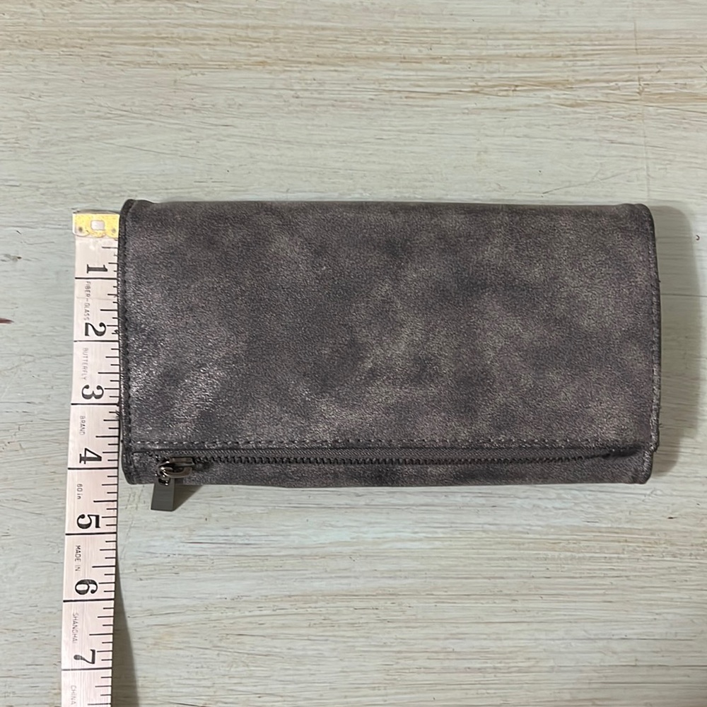 Wallet silver grey in color.